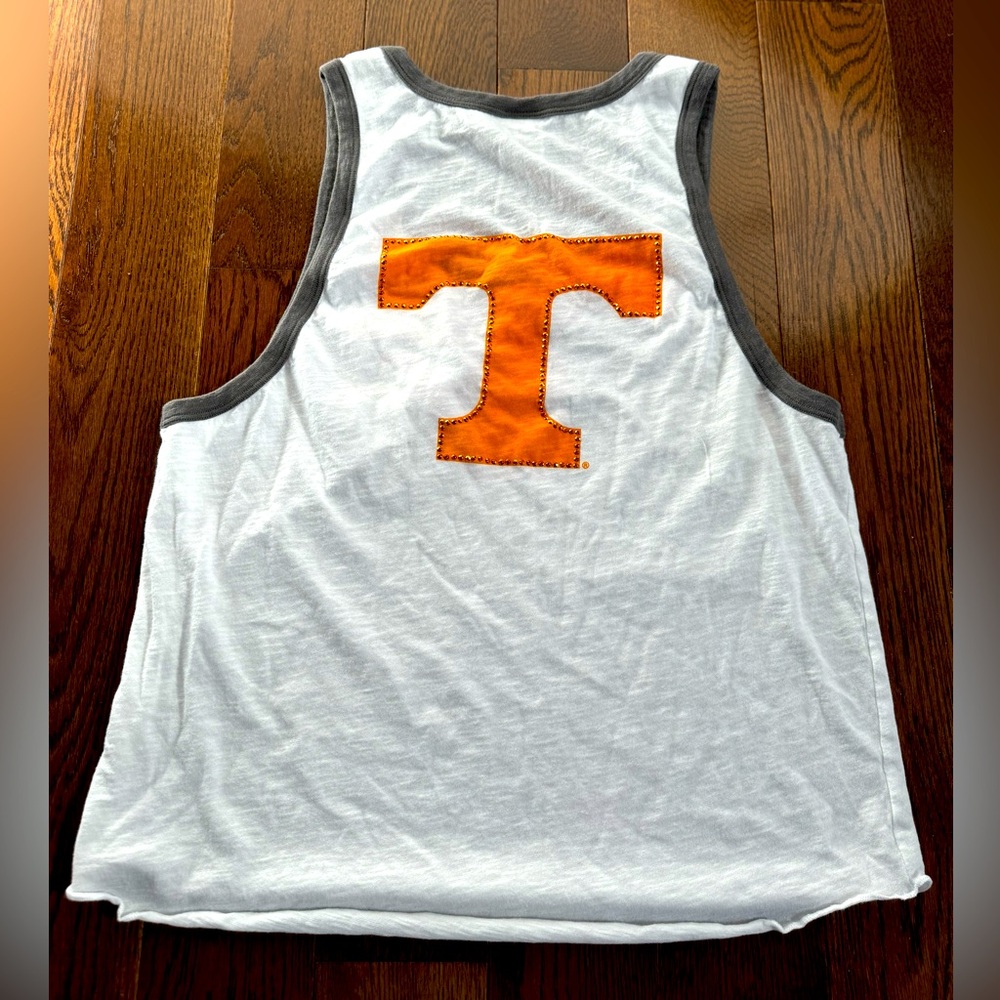 EUC Ladies Victoria Secret Tennessee white tank top with pocket detail.